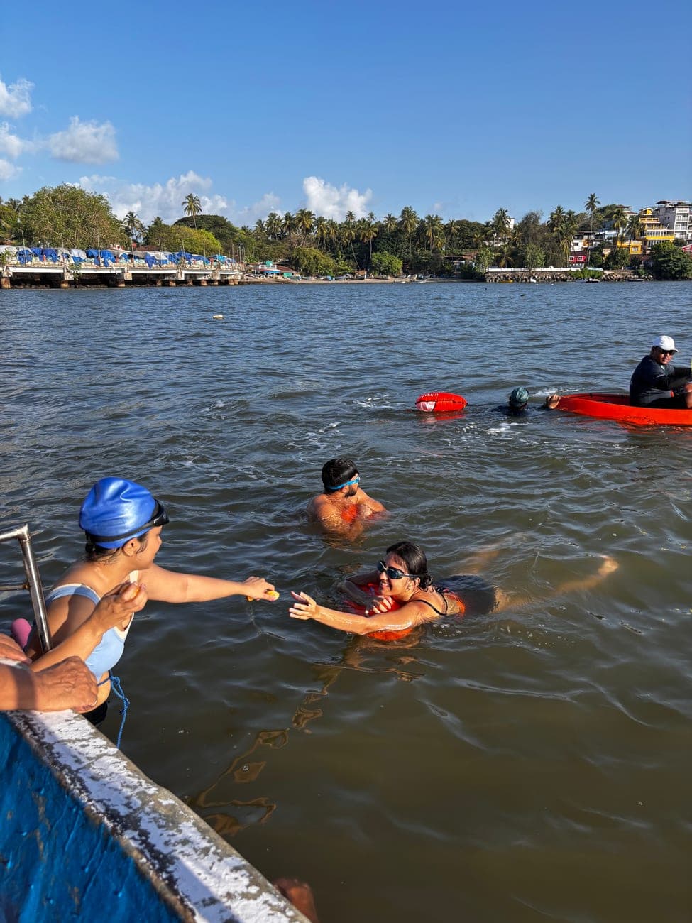 Swimmers gathered in the sea on a sunny morning